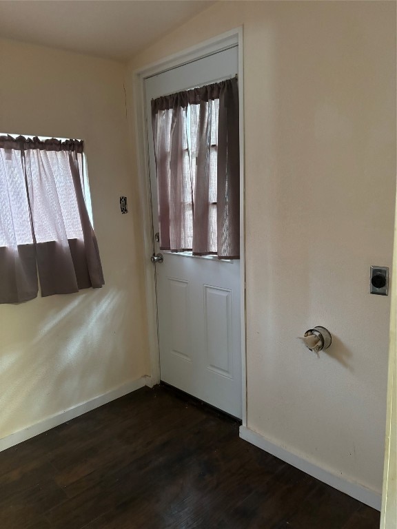 doorway featuring dark hardwood / wood-style flooring