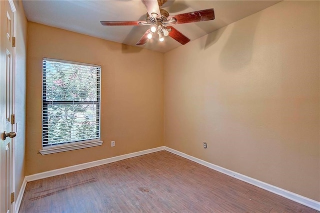 spare room with ceiling fan and hardwood / wood-style floors