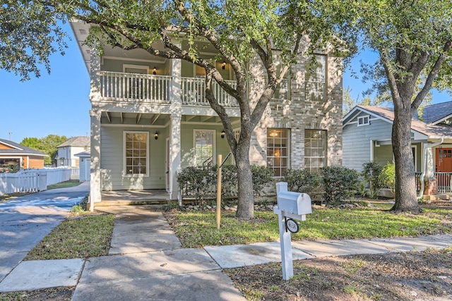 view of front of home with a balcony