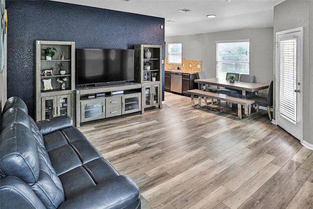 living room with light hardwood / wood-style flooring