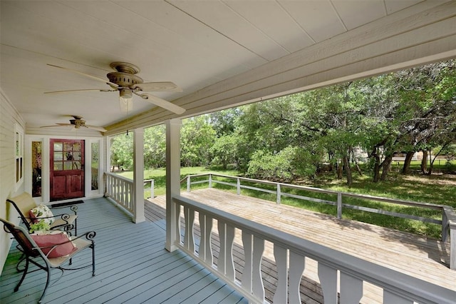 wooden terrace featuring ceiling fan