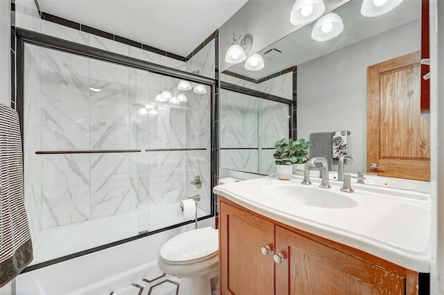 full bathroom with toilet, bath / shower combo with glass door, and vanity