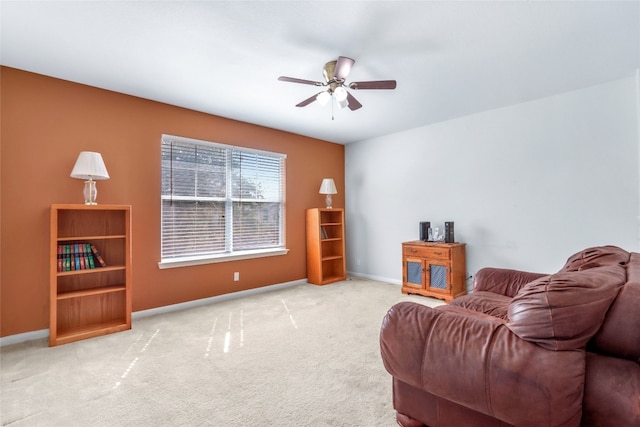 living room featuring light carpet and ceiling fan