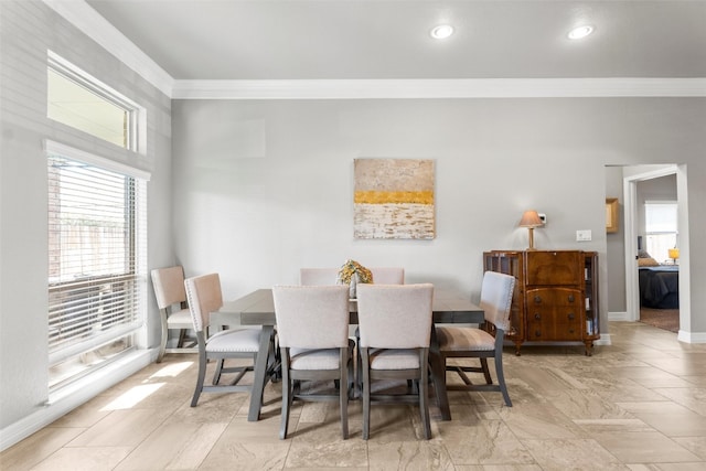 dining area featuring ornamental molding