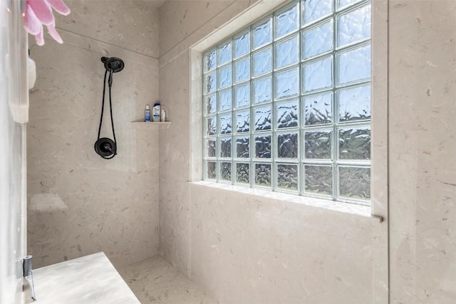 bathroom featuring tiled shower