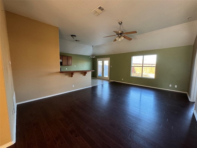 unfurnished living room with french doors, dark wood-type flooring, and ceiling fan