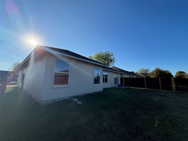 view of home's exterior with a yard