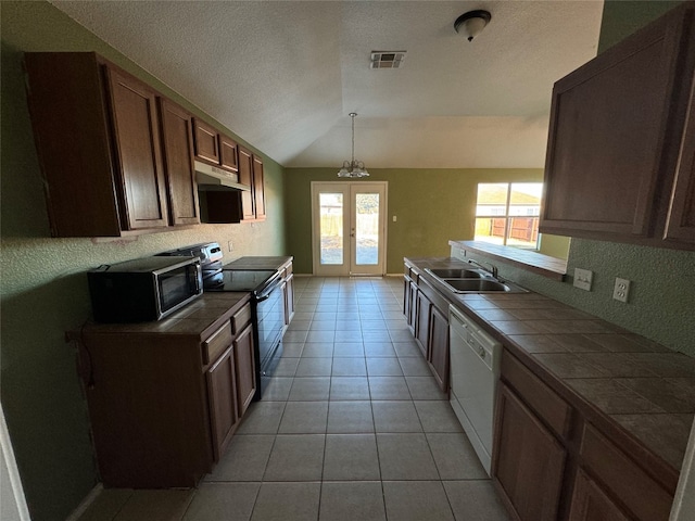 kitchen with tile countertops, white dishwasher, decorative light fixtures, stainless steel electric stove, and lofted ceiling