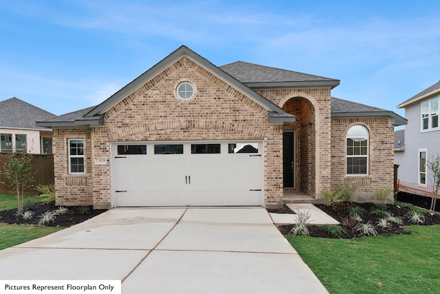 view of front facade featuring a garage and a front lawn