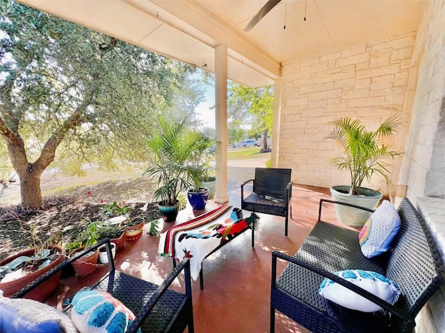 view of patio featuring ceiling fan and an outdoor living space