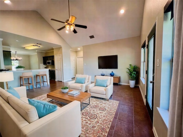 living room featuring high vaulted ceiling, dark tile patterned flooring, and ceiling fan with notable chandelier