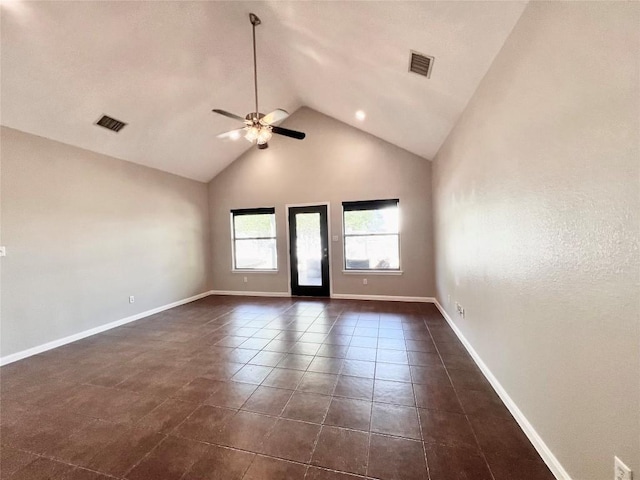 tiled empty room featuring high vaulted ceiling and ceiling fan