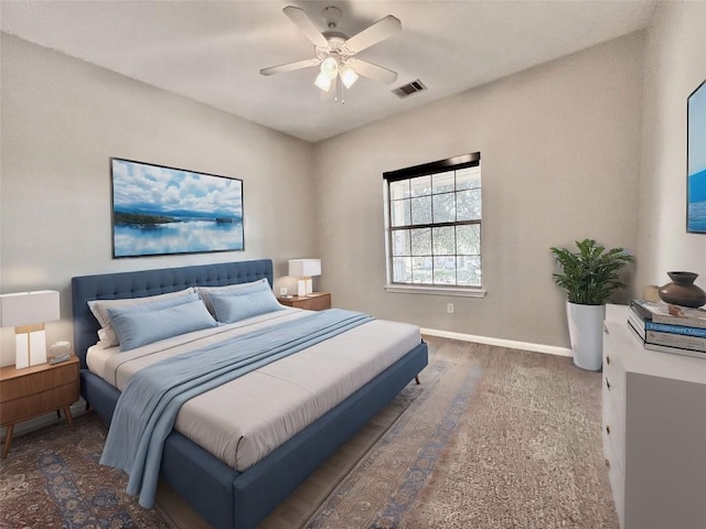 bedroom featuring ceiling fan and dark hardwood / wood-style flooring