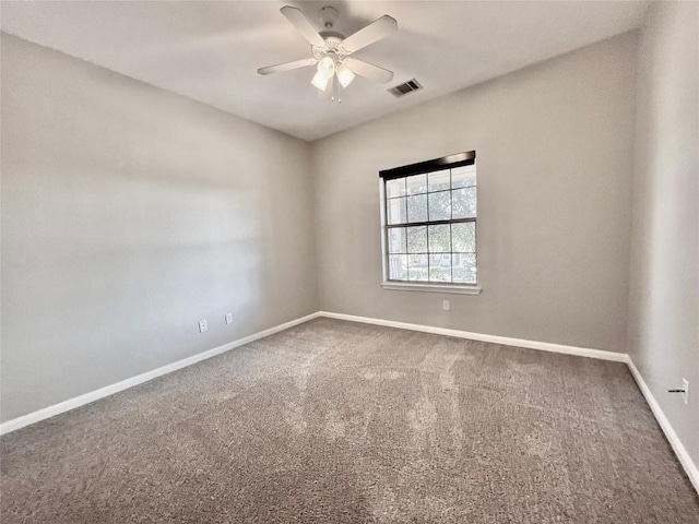 empty room with carpet floors and ceiling fan