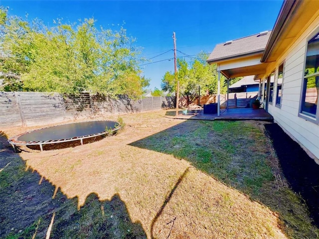 view of yard with a patio area and a trampoline