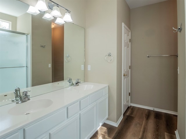 bathroom with vanity and hardwood / wood-style floors