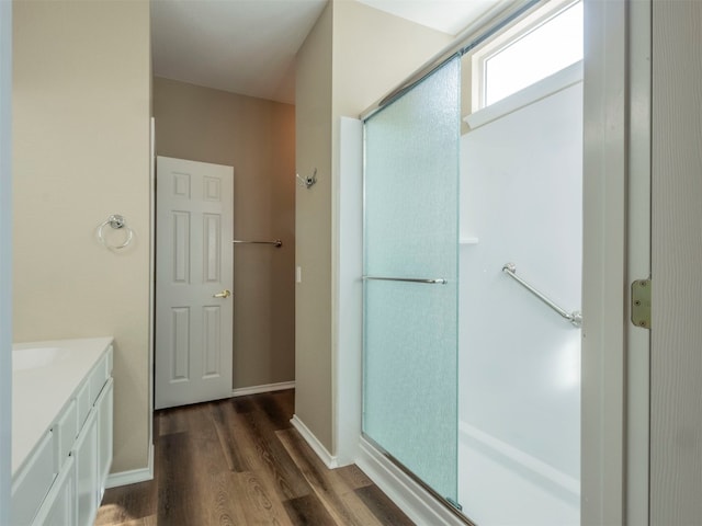 bathroom with hardwood / wood-style floors and vanity