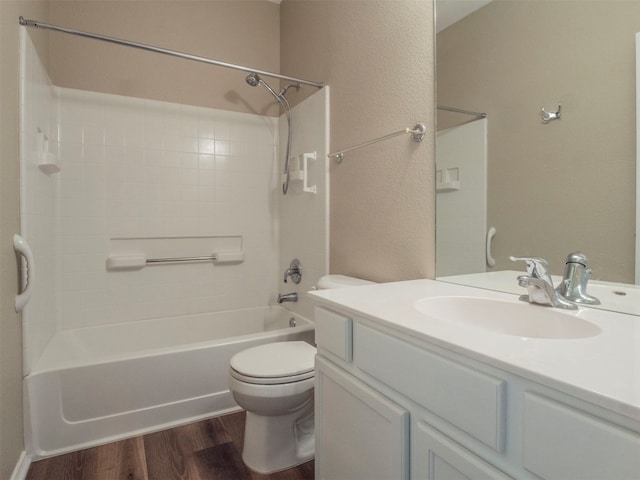 full bathroom featuring  shower combination, hardwood / wood-style flooring, vanity, and toilet