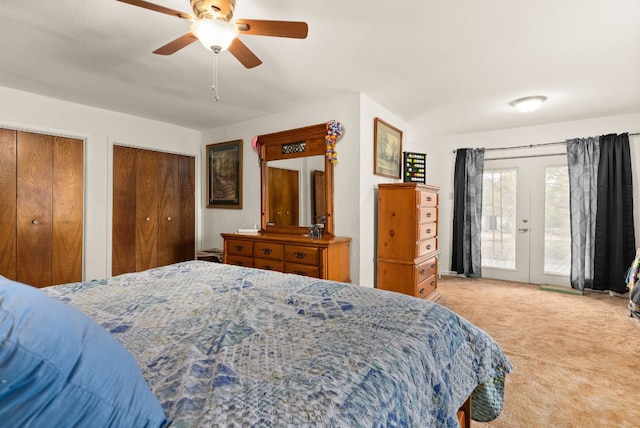 carpeted bedroom featuring multiple closets, french doors, ceiling fan, and access to exterior