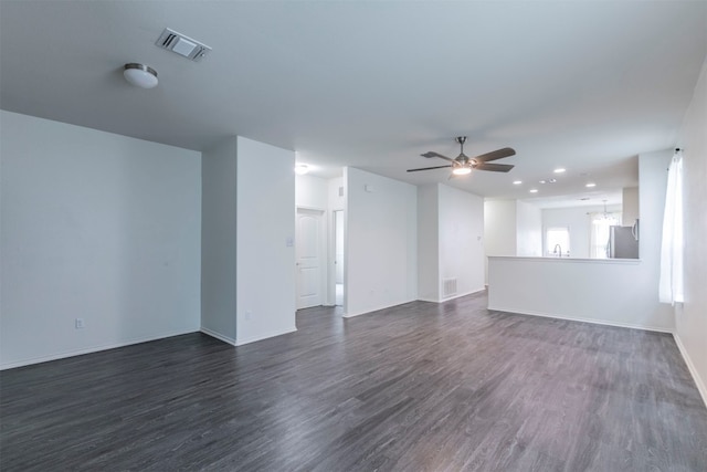 unfurnished room featuring dark hardwood / wood-style flooring and ceiling fan