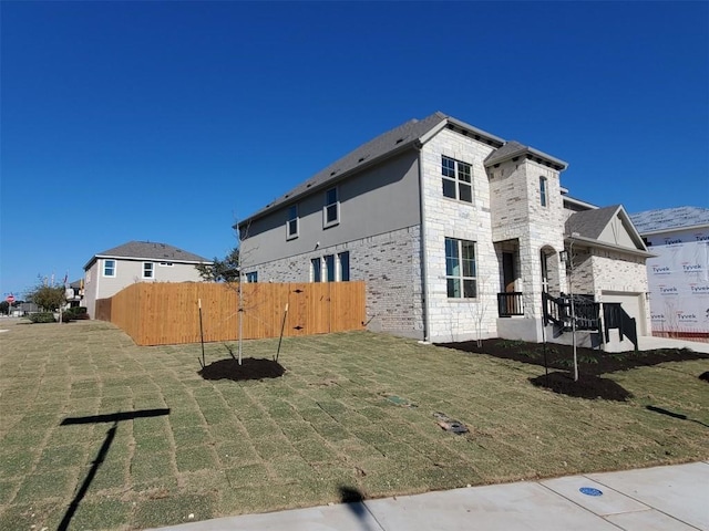 view of property exterior with a lawn and a garage