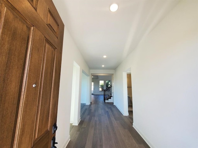 corridor featuring dark hardwood / wood-style floors