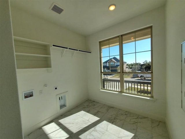 clothes washing area featuring electric dryer hookup, gas dryer hookup, and hookup for a washing machine