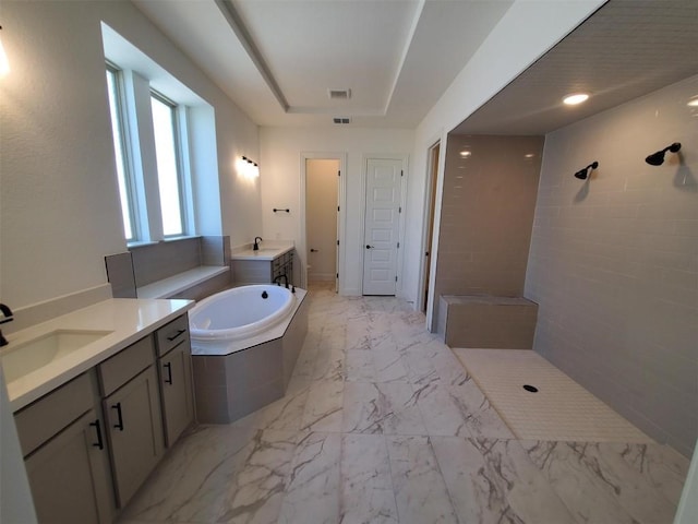 bathroom with shower with separate bathtub and vanity