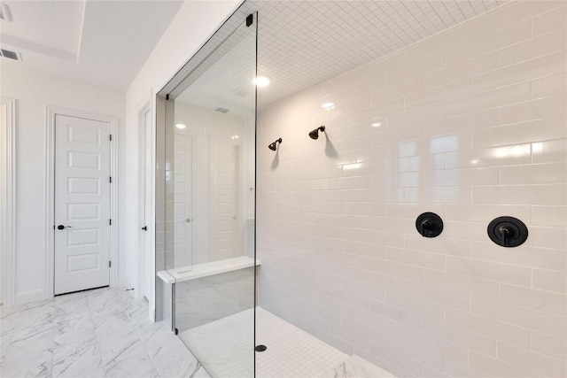 bathroom with tiled shower