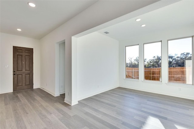 empty room with light wood-type flooring