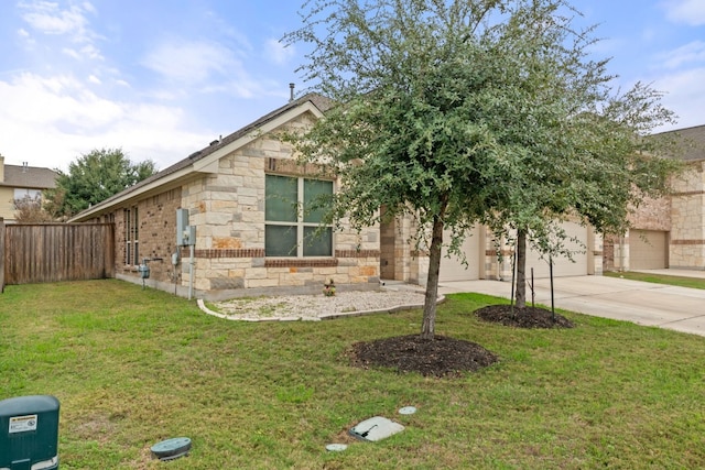 view of front of home with a front lawn and a garage