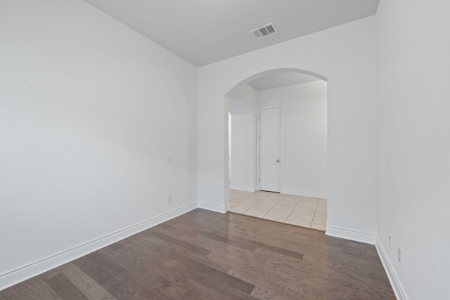 spare room with hardwood / wood-style flooring