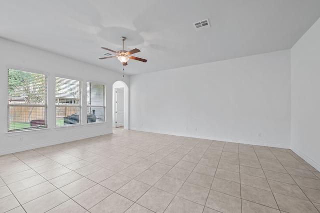 empty room featuring light tile patterned floors and ceiling fan