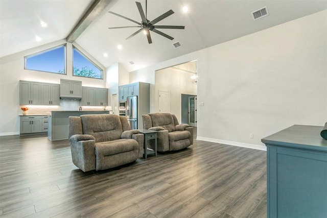 living room with beamed ceiling, ceiling fan with notable chandelier, dark hardwood / wood-style floors, and high vaulted ceiling