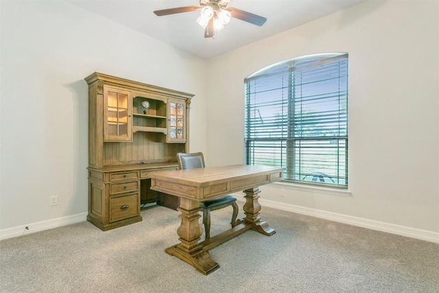 carpeted office with ceiling fan