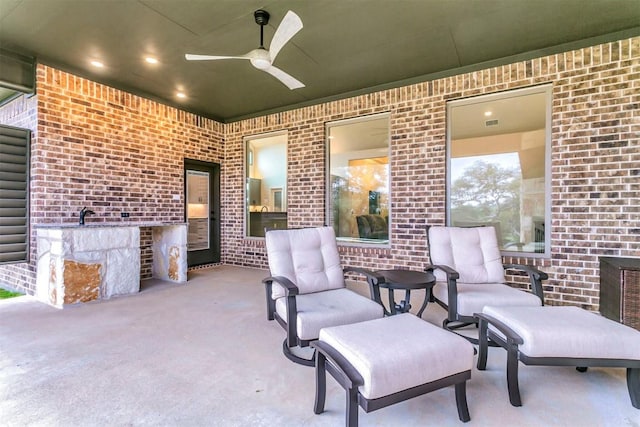 view of patio featuring ceiling fan