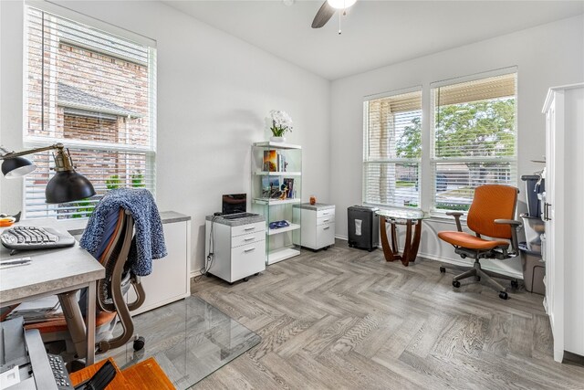 office featuring ceiling fan and light parquet flooring