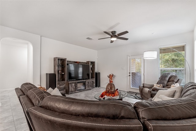 living room featuring light tile patterned floors and ceiling fan