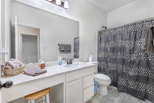 bathroom with toilet, vanity, and curtained shower