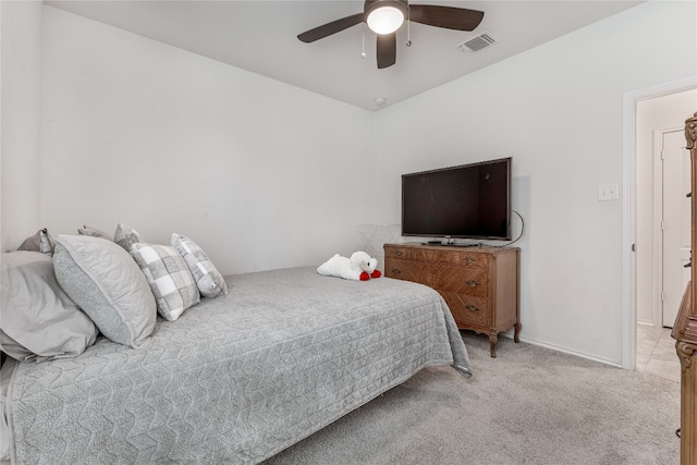 bedroom featuring ceiling fan and light carpet