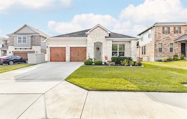 view of front of house with a garage and a front yard