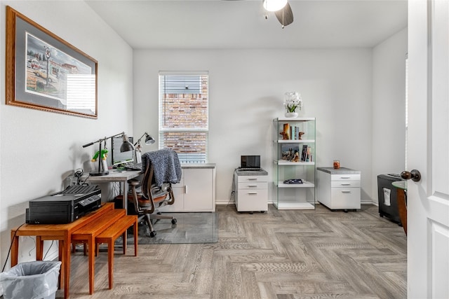 office area with light parquet flooring and ceiling fan