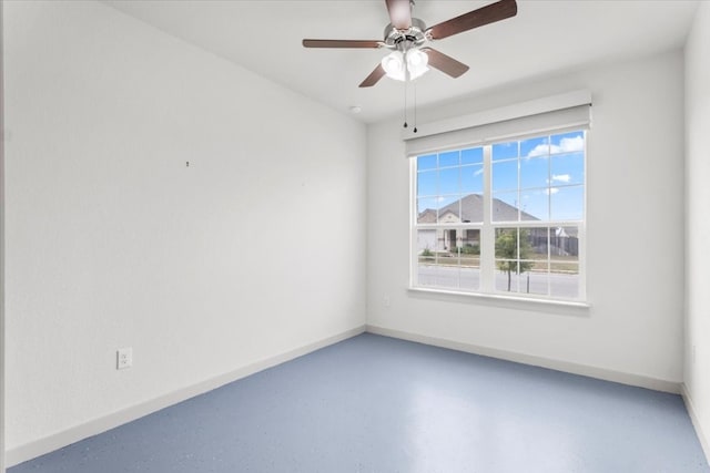 spare room with ceiling fan