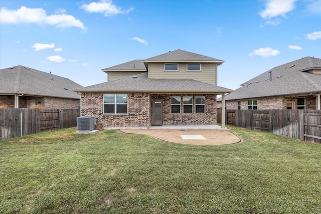 back of house with cooling unit, a lawn, and a patio