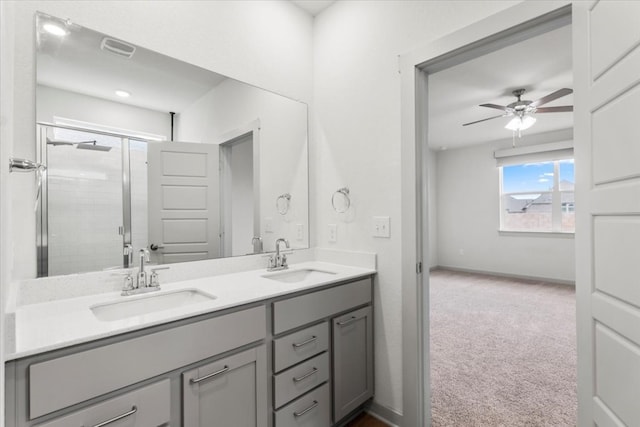 bathroom featuring vanity, an enclosed shower, and ceiling fan