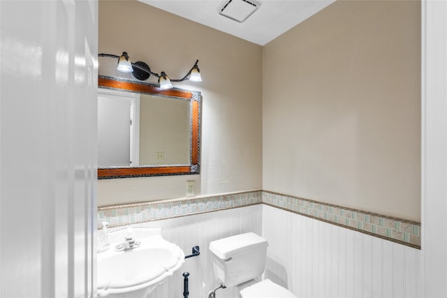 bathroom with sink and toilet