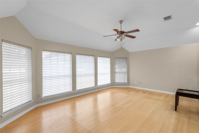 unfurnished room with light wood-type flooring, vaulted ceiling, and ceiling fan