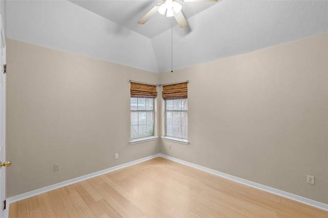 unfurnished room with ceiling fan, light wood-type flooring, and lofted ceiling