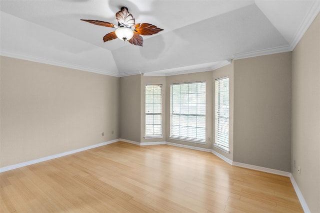 unfurnished room featuring ornamental molding, light wood-type flooring, vaulted ceiling, and ceiling fan