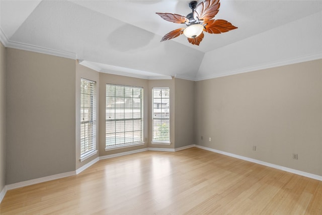 spare room with ceiling fan, light hardwood / wood-style flooring, vaulted ceiling, and ornamental molding